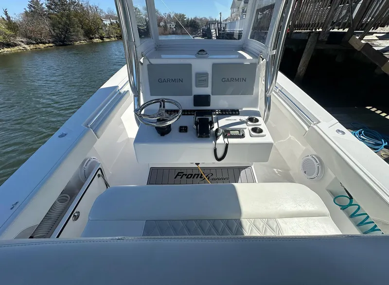 Slide: The Image of 2023 Front Runner 33 Center Console boat interior with Garmin navigation system. - 15
