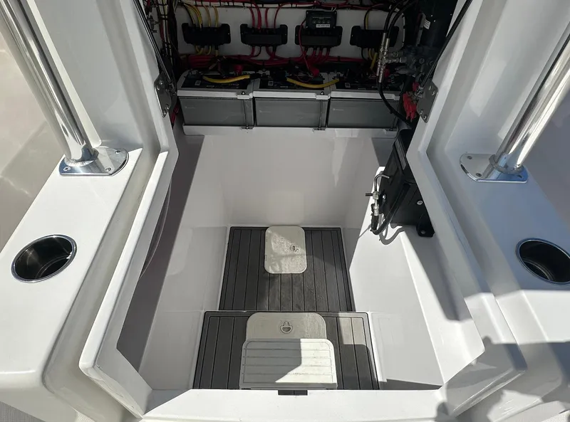 Slide: The Image of 2023 Front Runner 33 Center Console boat interior with wiring and storage compartment. - 22