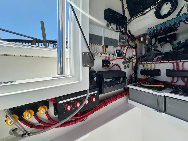 Slide: The Image of Interior view of 2023 Front Runner 33 Center Console boat's electrical system. - 23