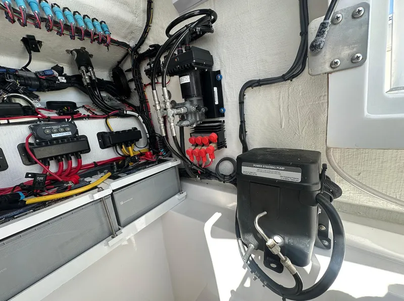 Slide: The Image of Electrical system inside 2023 Front Runner 33 Center Console boat, showcasing wiring and components. - 25