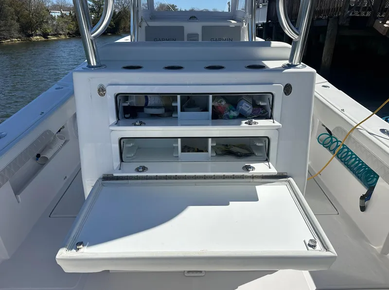 Slide: The Image of 2023 Front Runner 33 Center Console boat with open storage compartments. - 27