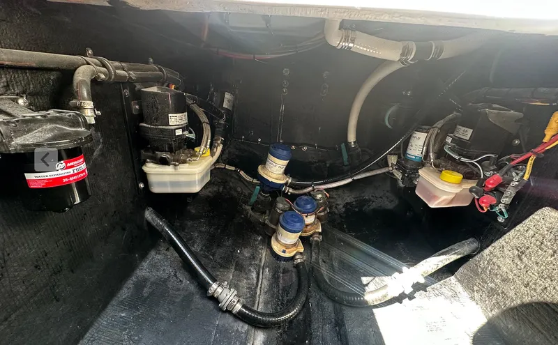 Slide: The Image of 2023 Front Runner 33 Center Console boat engine compartment with various mechanical components. - 29