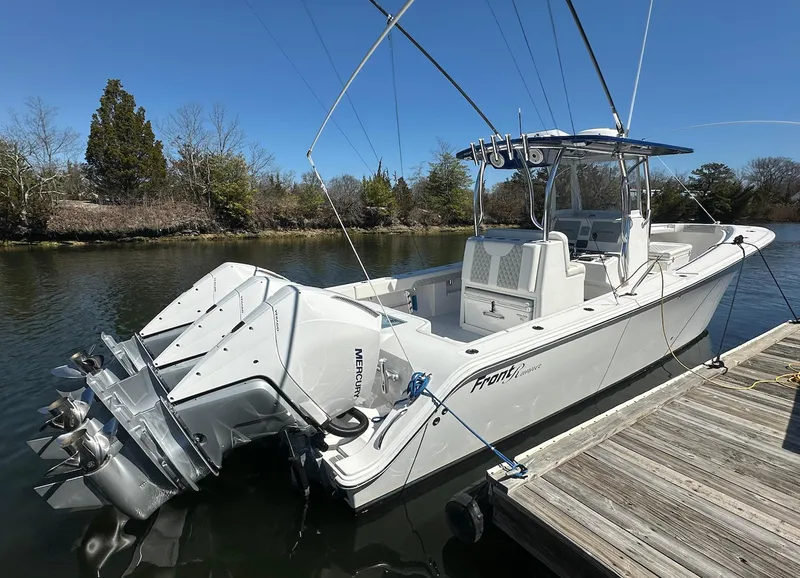Slide: The Image of 2023 Front Runner 33 Center Console boat docked on a sunny day. - 4