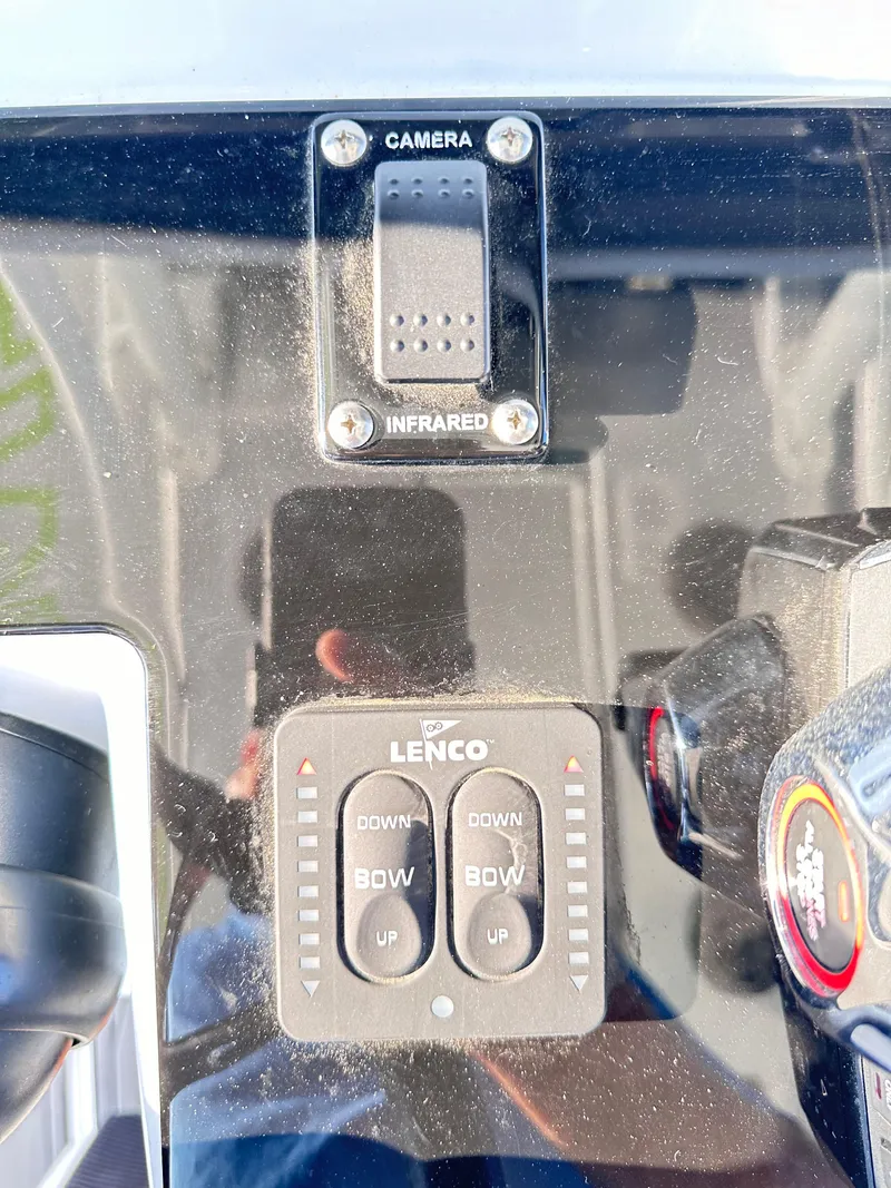 Slide: The Image of Control panel of 2023 Statement 350 Open with camera and Lenco trim tab switches. - 15