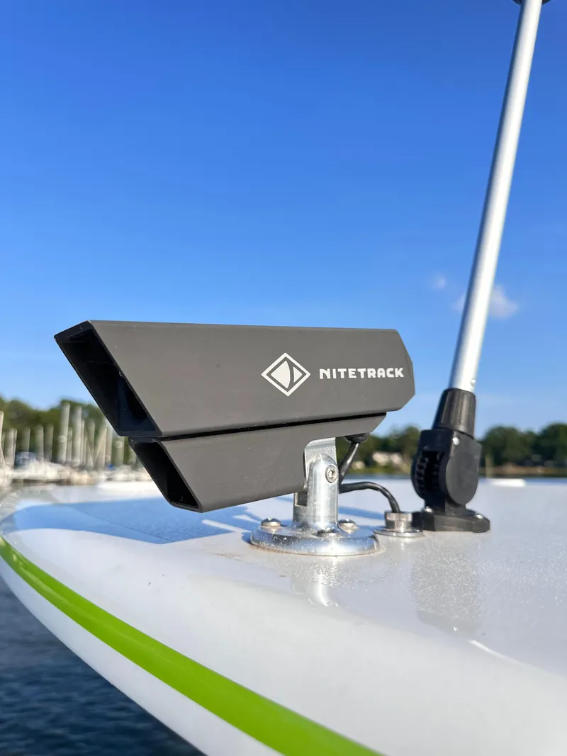 Slide: The Image of NiteTrack device on 2023 Statement 350 Open boat, clear sky background. - 19