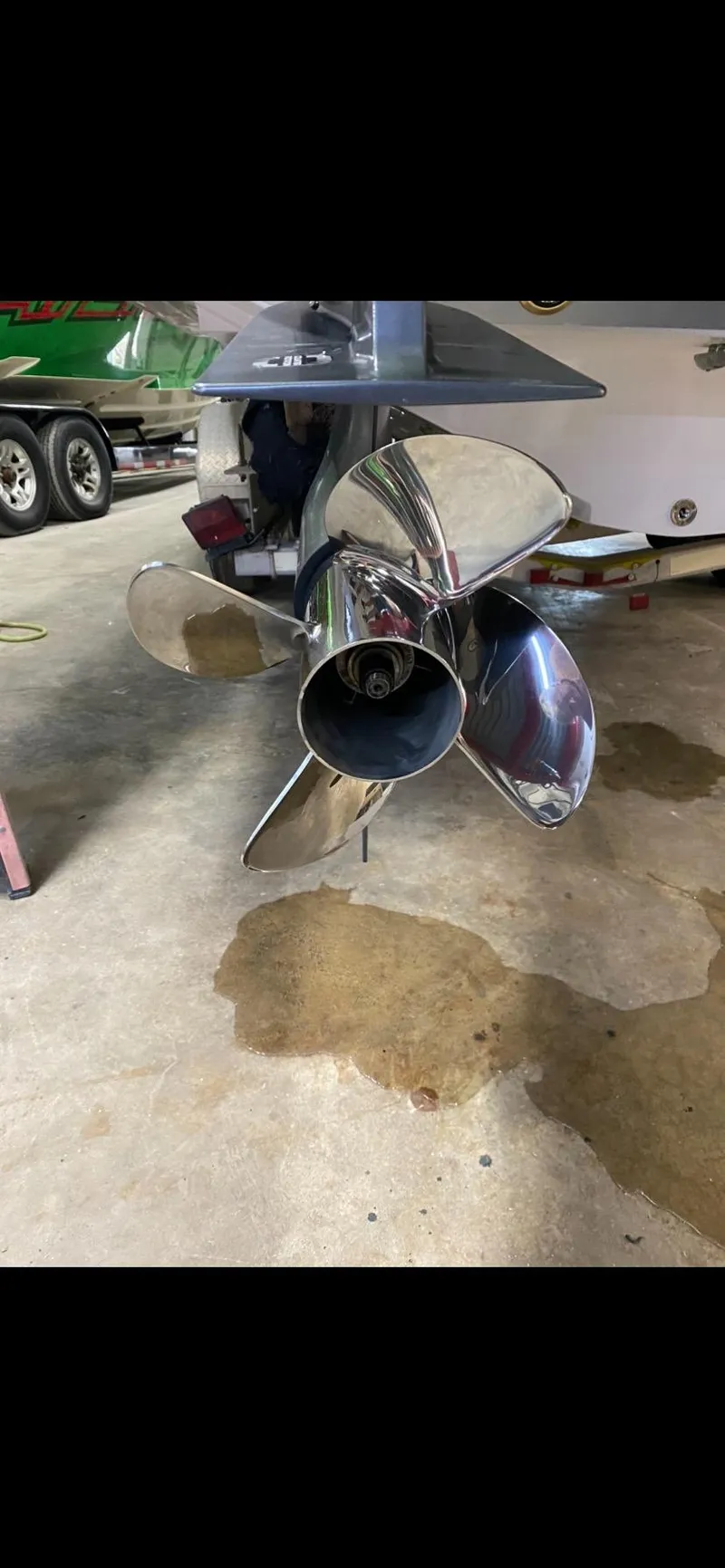 Slide: The Image of Propeller of 2023 Statement 350 Open boat in a garage setting. - 31