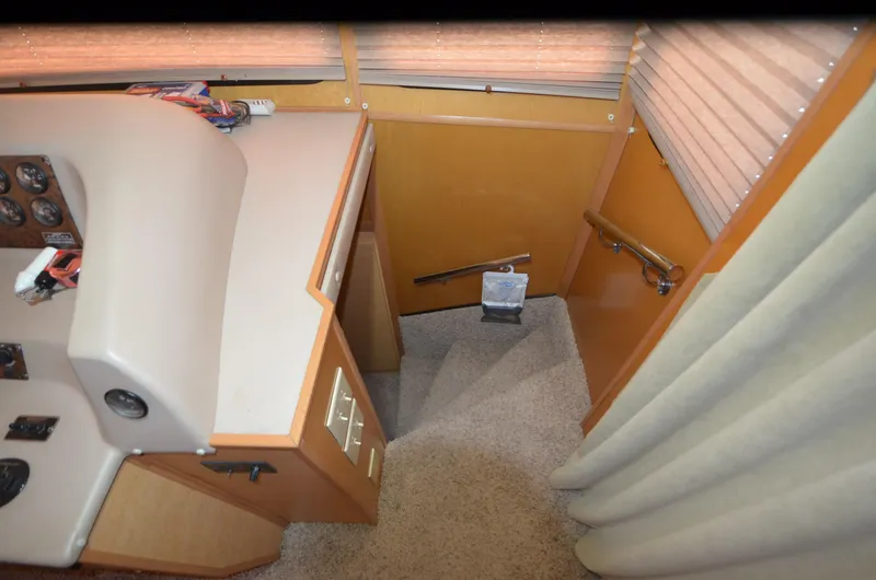 Slide: The Image of Interior of 2008 Gibson 47 Classic boat with stairs and control panel. - 16