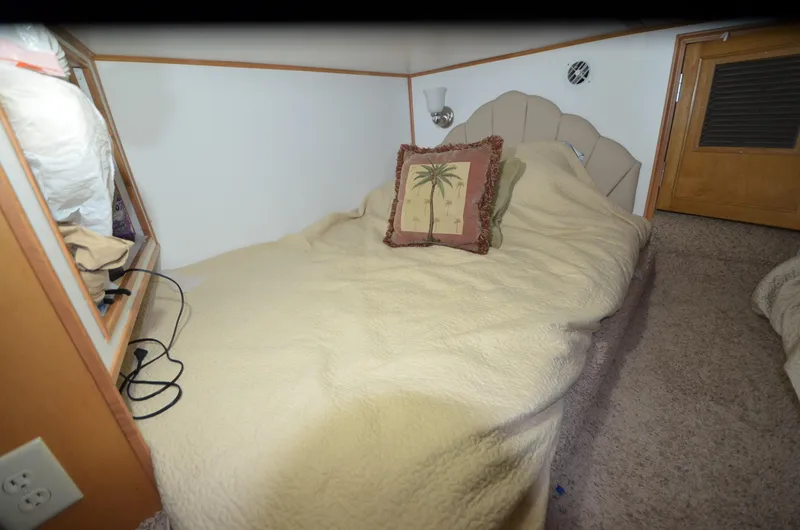 Slide: The Image of Cozy cabin bed in 2008 Gibson 47 Classic boat with palm tree pillow. - 17