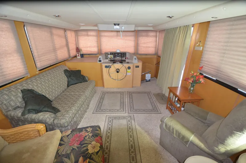 Slide: The Image of Spacious interior of 2008 Gibson 47 Classic houseboat with cozy seating and helm station. - 3