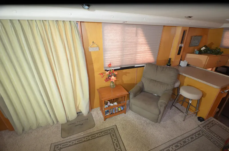 Slide: The Image of Cozy interior of a 2008 Gibson 47 Classic with recliner and floral decor. - 5