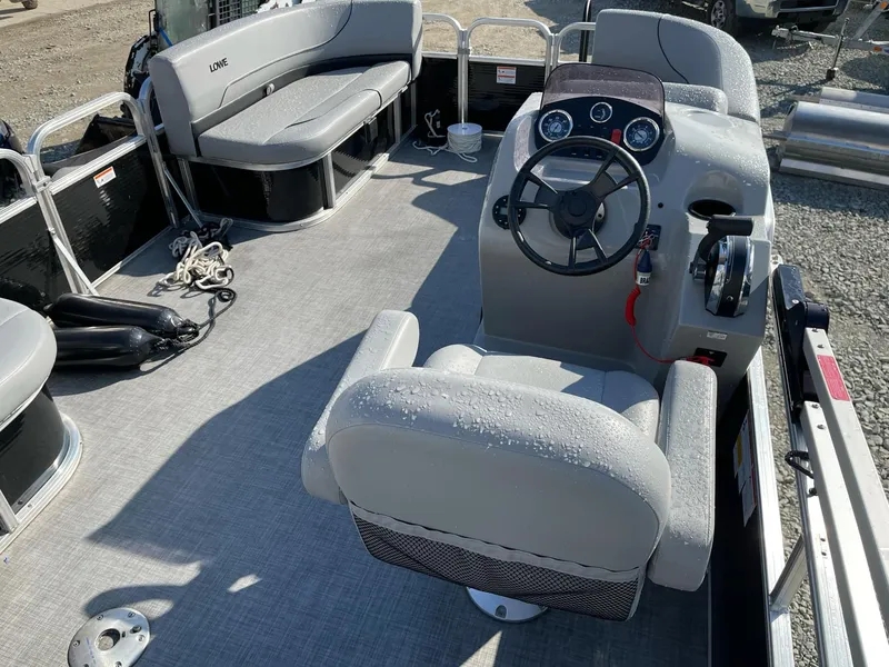Slide: The Image of 2020 Lowe Ultra 160 Cruise pontoon boat interior with steering console and seating. - 13