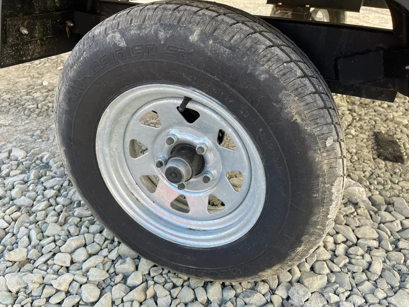 Slide: The Image of Trailer wheel on gravel, Lowe Ultra 160 Cruise, 2020 model. - 16