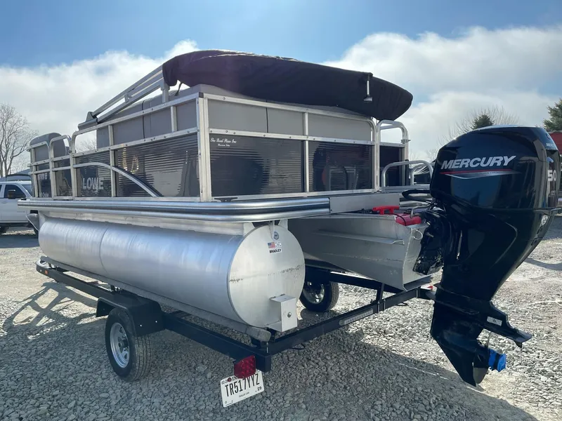 Slide: The Image of 2020 Lowe Ultra 160 Cruise pontoon boat with Mercury outboard motor on trailer. - 5