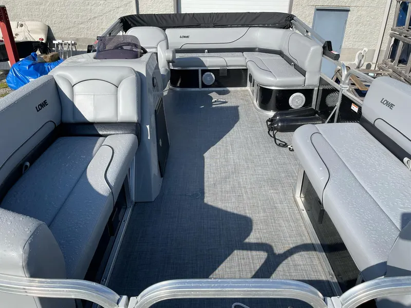 Slide: The Image of 2020 Lowe Ultra 160 Cruise pontoon boat with spacious seating and modern design. - 6