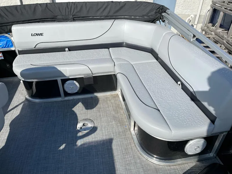 Slide: The Image of 2020 Lowe Ultra 160 Cruise pontoon boat with gray seating and modern design. - 9