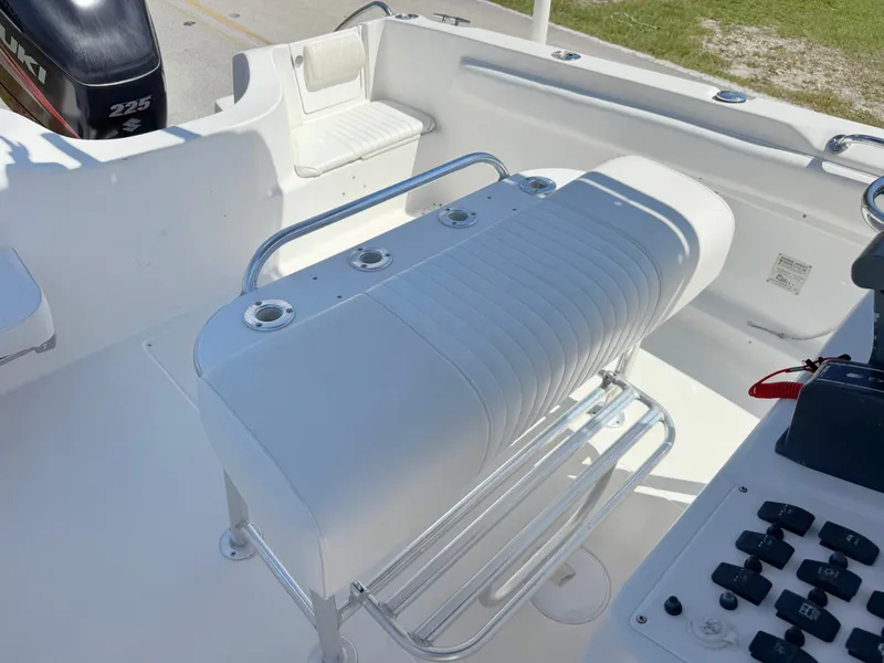Slide: The Image of 2005 Sea Chaser 2100 Offshore boat interior with seating and control panel. - 12