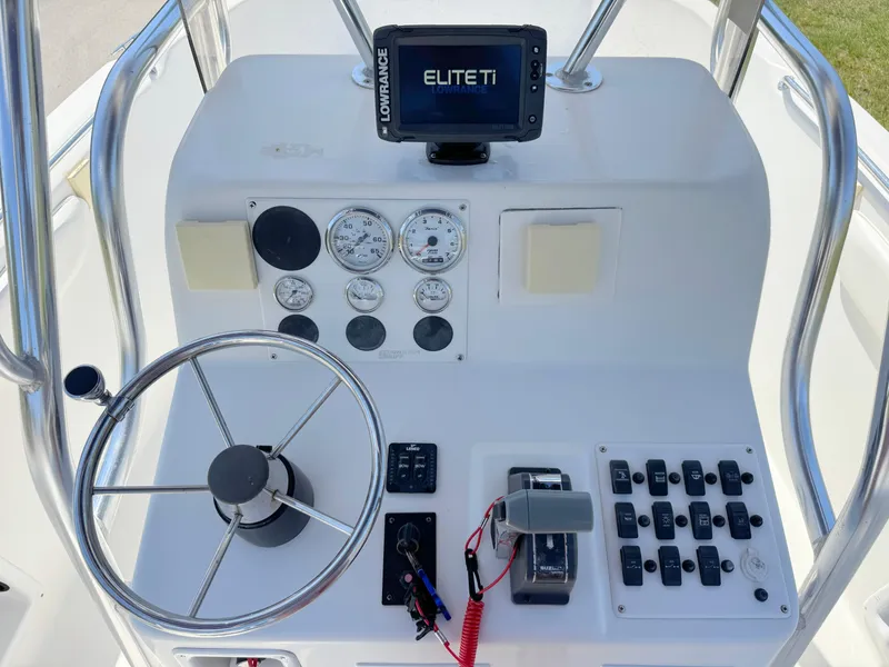 Slide: The Image of Control panel of a 2005 Sea Chaser 2100 Offshore boat with steering wheel and gauges. - 15