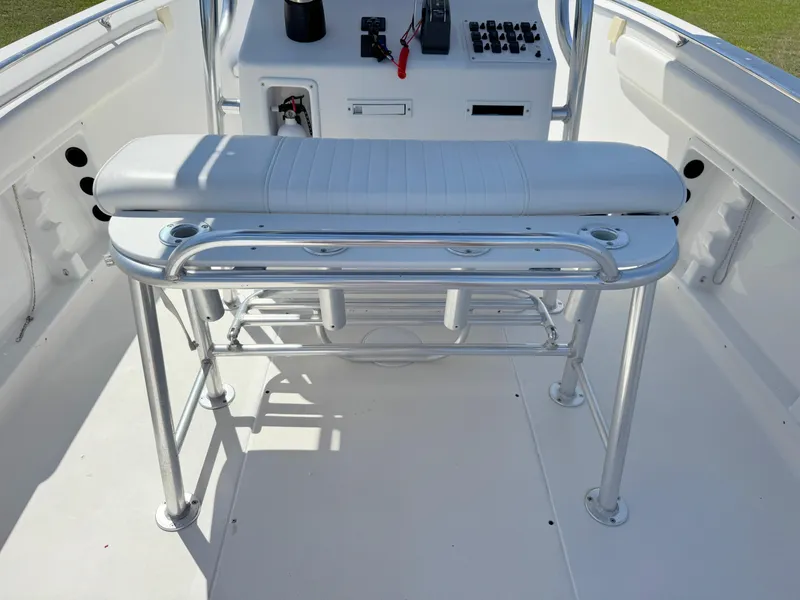 Slide: The Image of 2005 Sea Chaser 2100 Offshore boat interior with bench seating and control panel. - 25