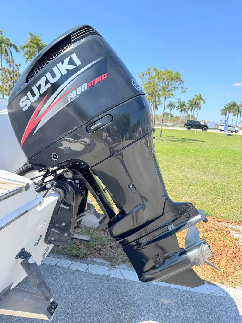 Slide: The Image of Suzuki four-stroke outboard motor on 2005 Sea Chaser 2100 Offshore boat, sunny day. - 29