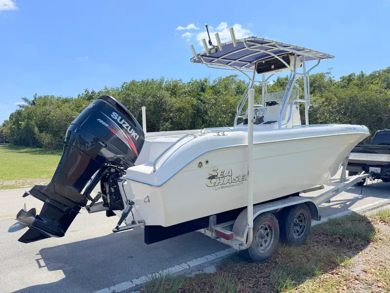 Slide: The Image of 2005 Sea Chaser 2100 Offshore boat on trailer with Suzuki outboard motor. - 4