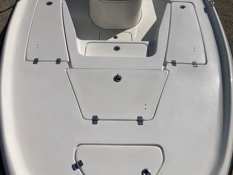 Slide: The Image of 2025 Key West 250BR boat deck with storage compartments and sleek design. - 10