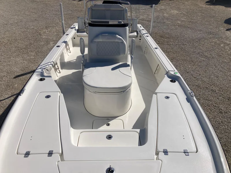 Slide: The Image of 2025 Key West 250BR boat interior with seating and storage compartments. - 11