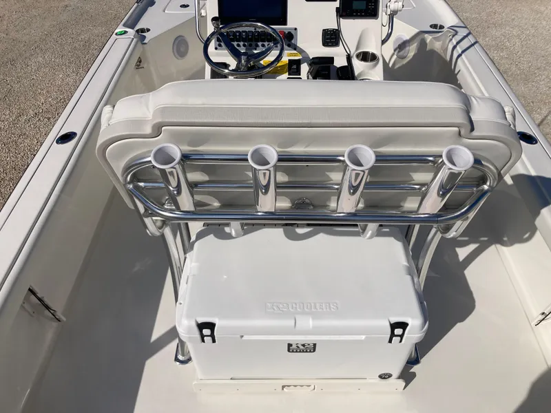 Slide: The Image of 2025 Key West 250BR boat interior with seating, rod holders, and cooler. - 6