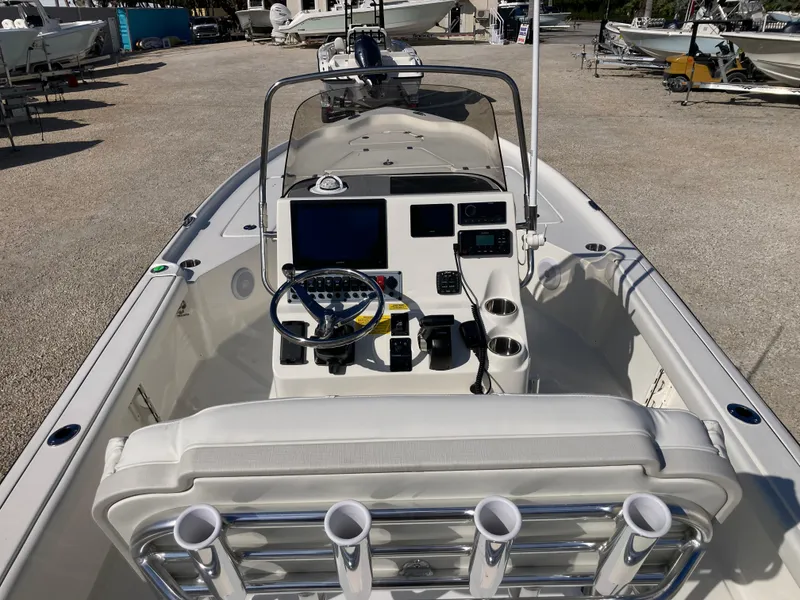 Slide: The Image of 2025 Key West 250BR boat interior with modern dashboard and steering wheel. - 7