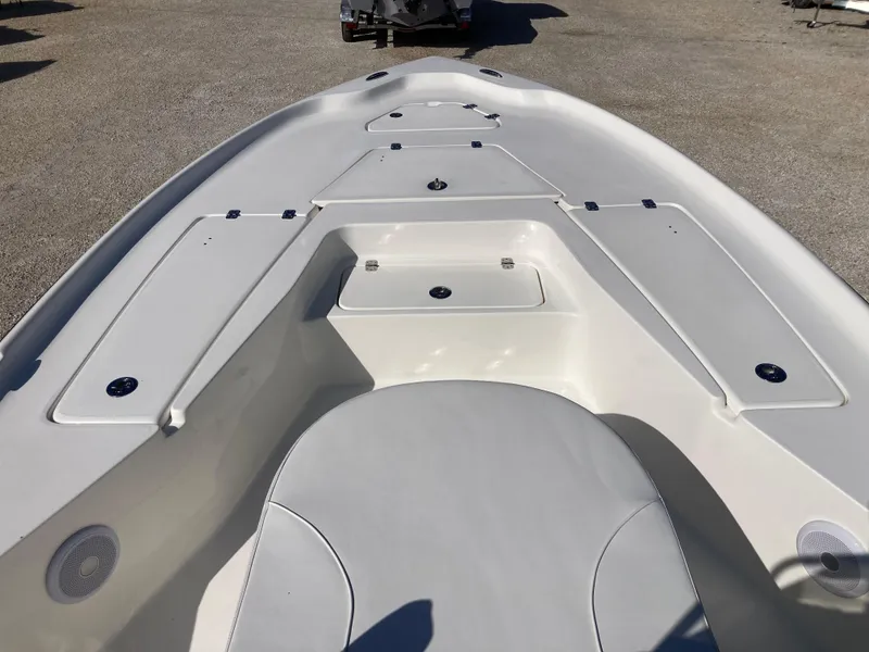 Slide: The Image of 2025 Key West 250BR boat interior with spacious seating and storage compartments. - 9