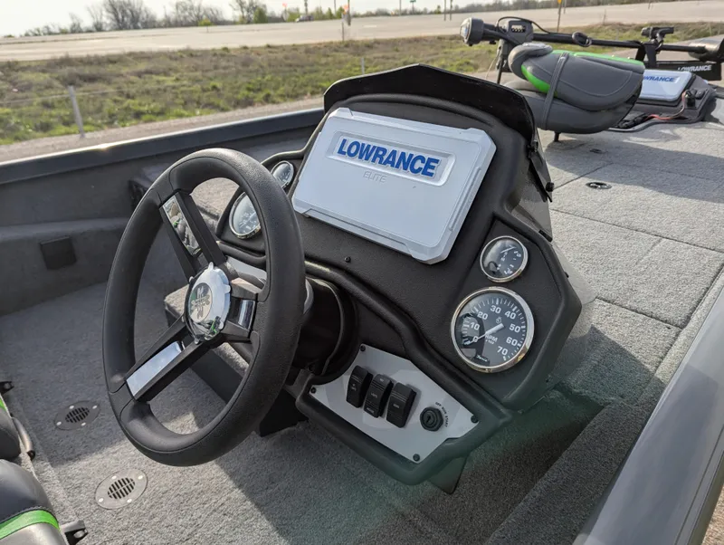 Slide: The Image of 2023 Ranger RT188P boat dashboard with Lowrance electronics and steering wheel. - 13