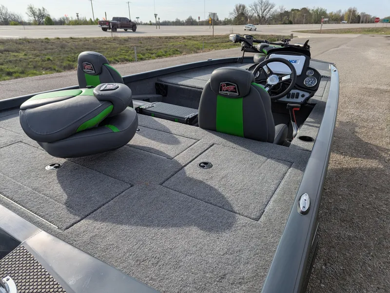 Slide: The Image of 2023 Ranger RT188P fishing boat with green-accented seats and spacious deck. - 14