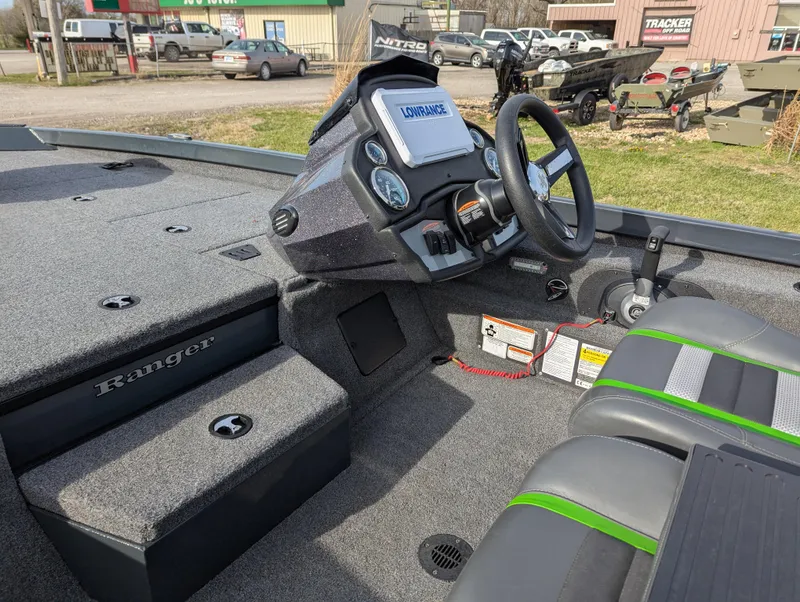 Slide: The Image of 2023 Ranger RT188P boat interior with steering wheel and dashboard, featuring modern design and controls. - 15