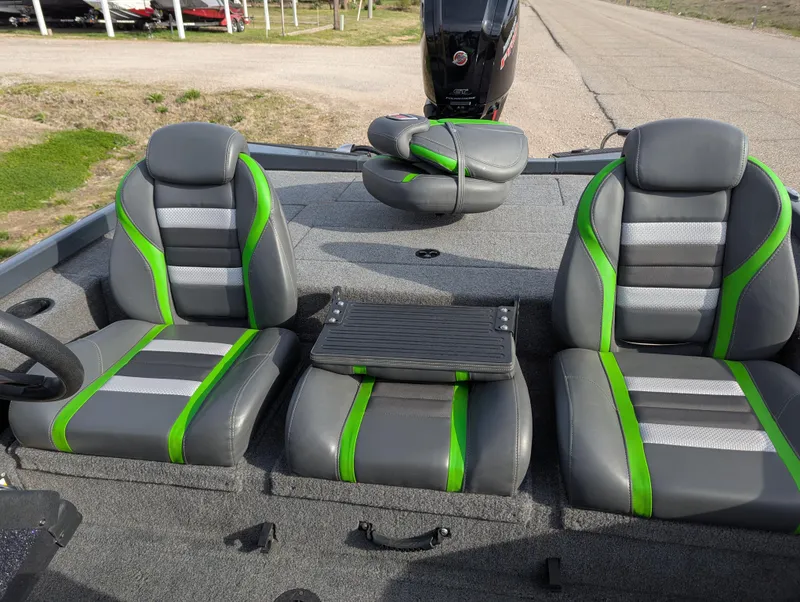 Slide: The Image of 2023 Ranger RT188P boat interior with gray and green seats, featuring a central console. - 17
