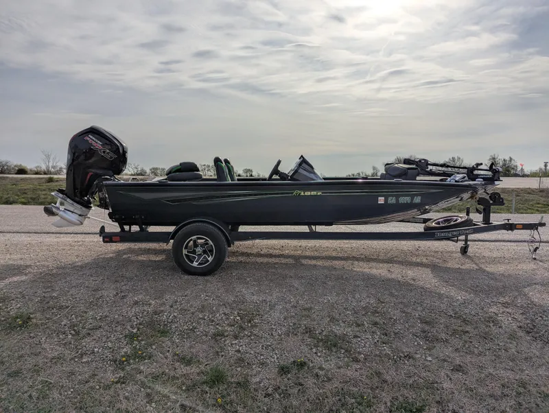 Slide: The Image of 2023 Ranger RT188P fishing boat on trailer, side view, outdoors. - 8