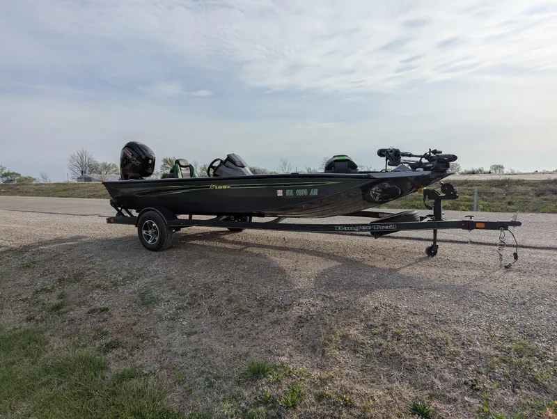 Slide: The Image of 2023 Ranger RT188P fishing boat on trailer, parked outdoors. - 9