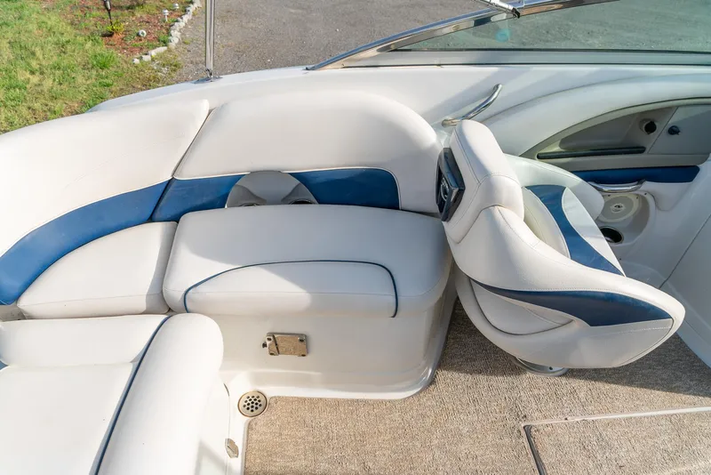 Slide: The Image of 2012 Crownline Eclipse E2 boat interior with white and blue seating. - 17