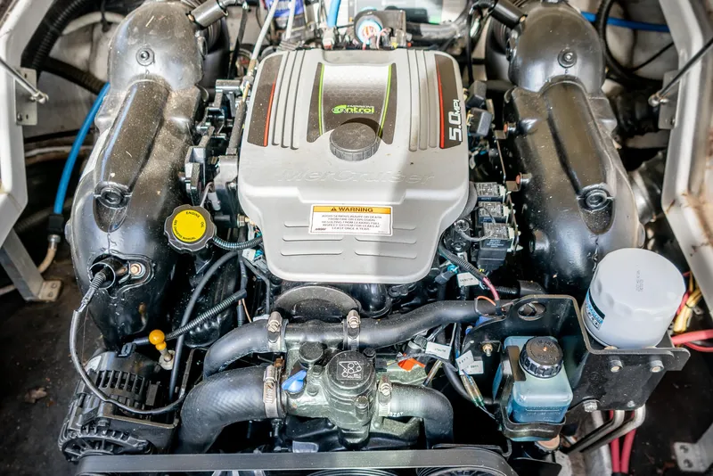 Slide: The Image of Engine of a 2012 Crownline Eclipse E2 boat, showcasing detailed components and layout. - 22