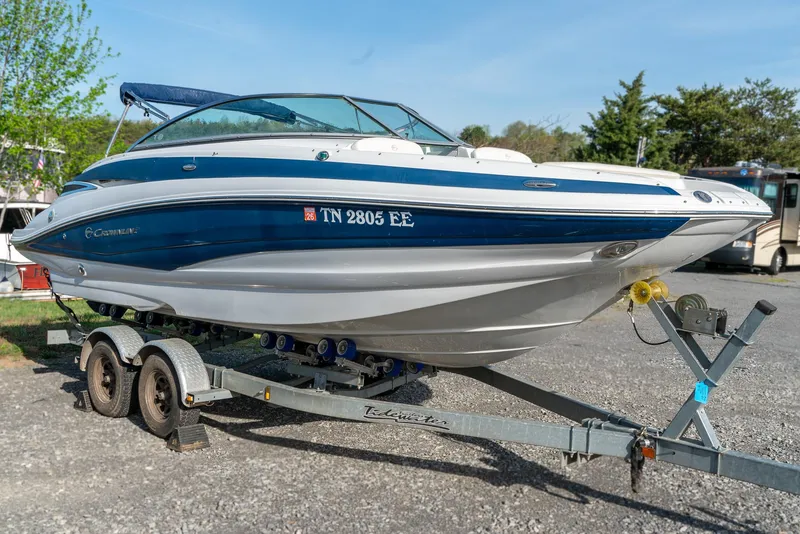 Slide: The Image of 2012 Crownline Eclipse E2 boat on trailer, parked outdoors. - 4