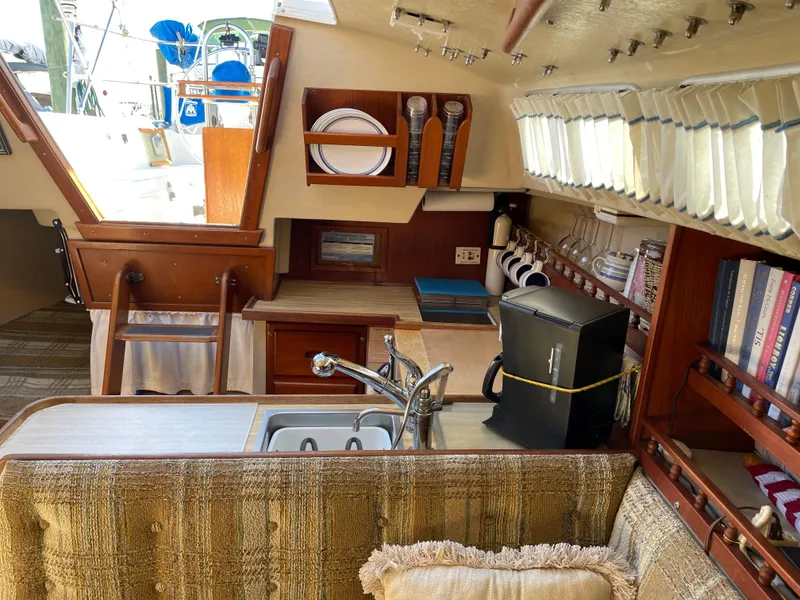 Slide: The Image of Interior of a 1982 Catalina 30 sailboat with kitchen and storage. - 30