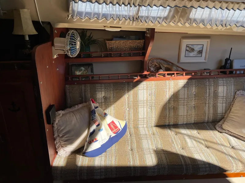 Slide: The Image of Interior of a 1982 Catalina 30 sailboat with cozy seating and nautical decor. - 32