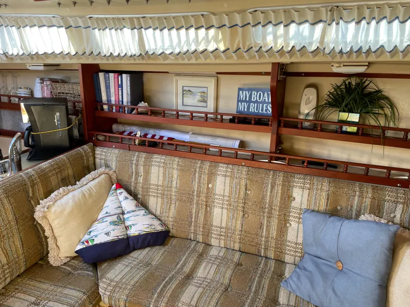 Slide: The Image of Interior of a 1982 Catalina 30 sailboat with cozy seating and nautical decor. - 35