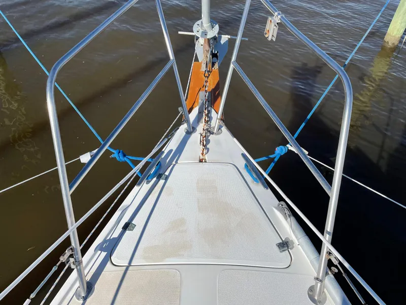 Slide: The Image of Bow of 1982 Catalina 30 sailboat with stainless steel railings and anchor chain. - 8