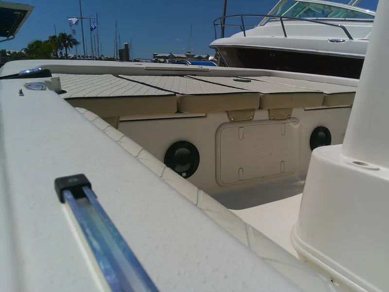 Slide: The Image of 2021 Carolina Skiff 17 LS boat interior with storage compartments and seating. - 17