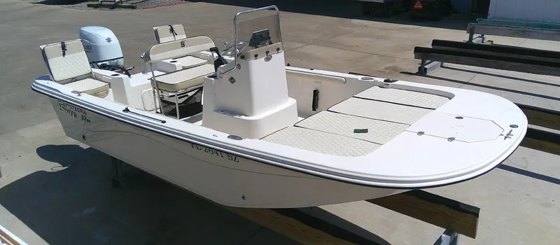 Slide: The Image of 2021 Carolina Skiff 17 LS boat on display, featuring a center console and seating. - 4