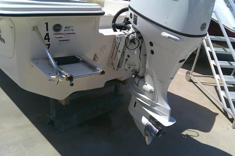 Slide: The Image of 2021 Carolina Skiff 17 LS boat with outboard motor and swim platform. - 6