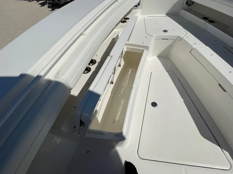 Slide: The Image of 2022 Regulator 31 boat interior with spacious seating and storage compartments. - 10