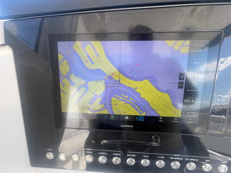 Slide: The Image of Garmin navigation display on 2022 Regulator 31 boat, showing detailed marine map. - 19