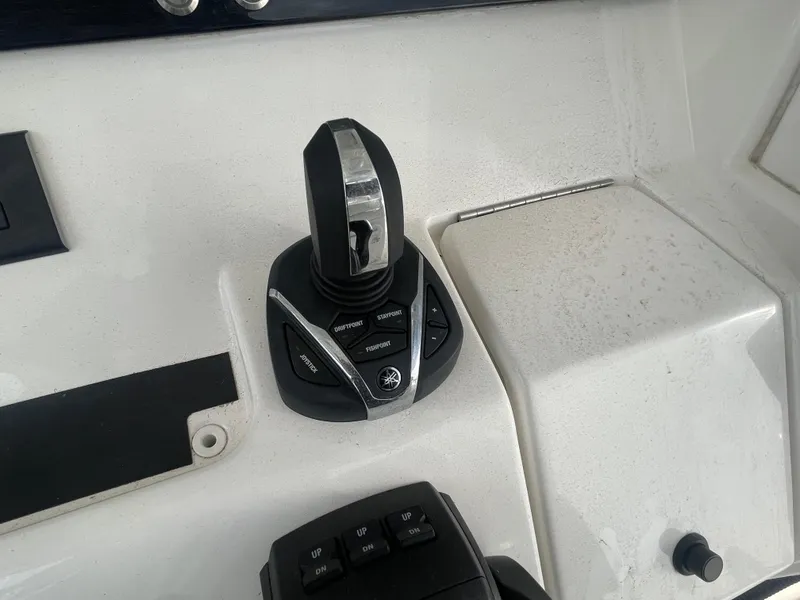 Slide: The Image of Joystick control on a 2022 Regulator 31 boat dashboard. - 24