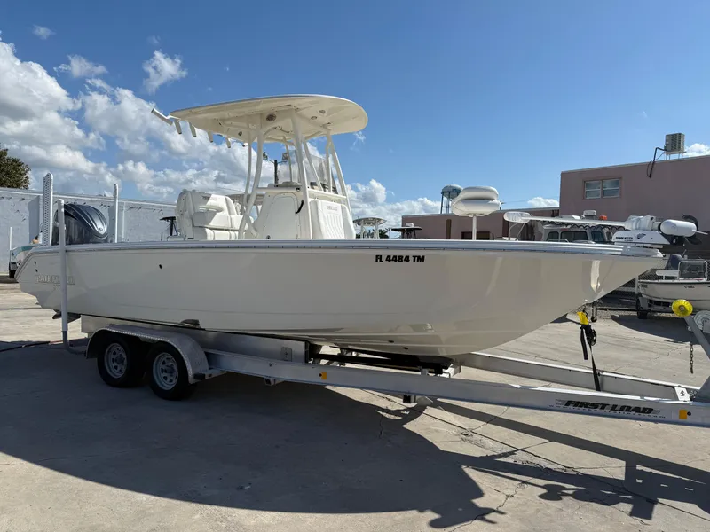 Slide: The Image of 2023 Pathfinder 2400 Open boat on trailer under clear blue sky. - 1