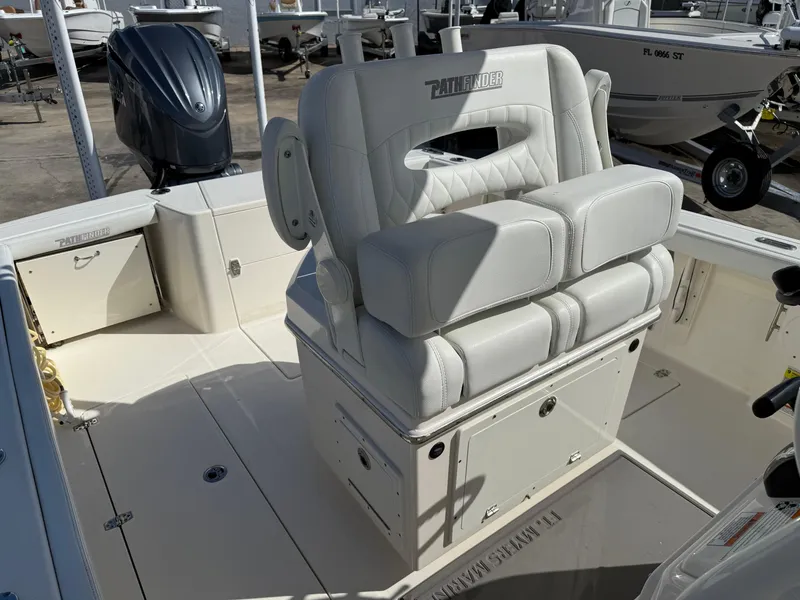 Slide: The Image of 2023 Pathfinder 2400 Open boat interior with cushioned seating and storage compartments. - 11